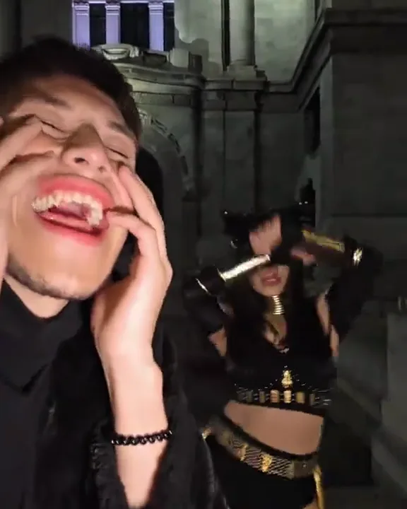 Fangs in, hands on the cheeks